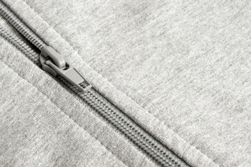 Closeup of zipper in gray cloth © Popova Olga