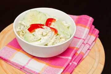 a fresh cucumber salad in a bowl
