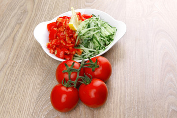 whole tomatoes on branch with salad