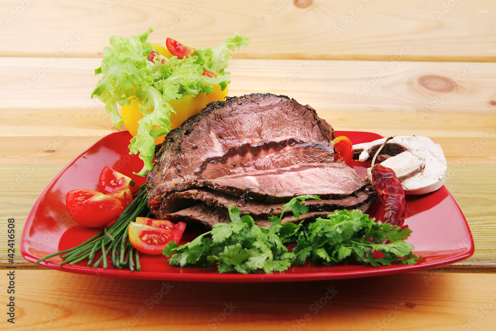 Wall mural hot beef on red plate