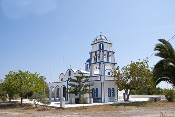 A Blue and White Greek Orthodox Church and Bell Tower