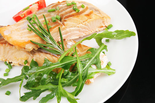 salmon fillet garnished with rocula