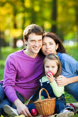 Family having picnic in autumn