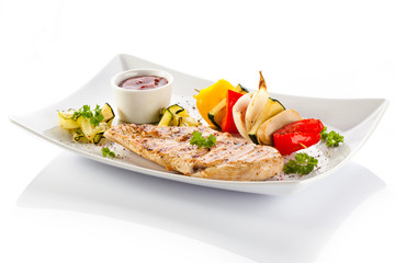 Grilled chicken breasts and vegetables
