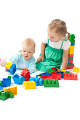 children play with blocks in studio