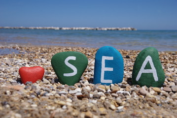I love the sea on colourful stones and red heart