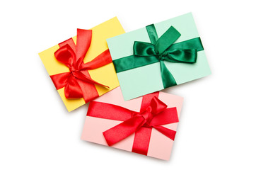 Envelope with colourful ribbon on white