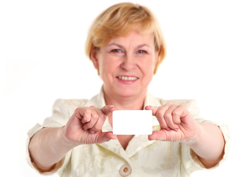 Smiling mature businesswoman holding blank empty card