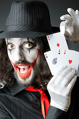 clown with cards in studio shoot