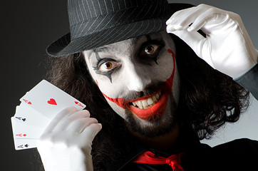 clown with cards in studio shoot