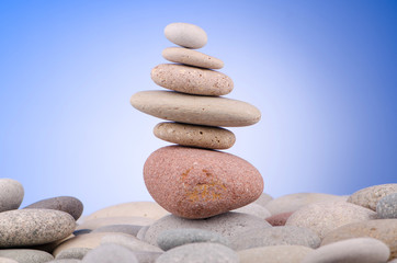 Pebbles stack against gradient background