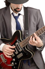 Fototapeta na wymiar Young guitar player isolated on white