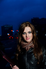 Young brunette business woman holding briefcase