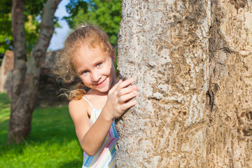 Girl hugging a tree