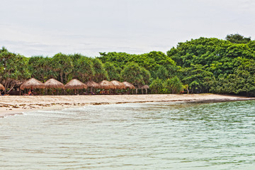 Wooden arbors on Nus Duah's beach to Bali