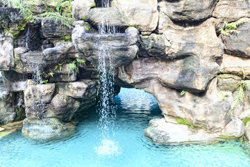 Decorative falls with  turquoise water 