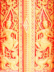 The gold stucco design of native thai style on the Wall