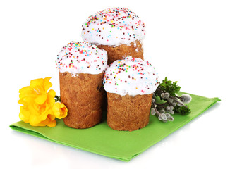 Beautiful Easter cakes, colorful eggs in basket and flowers