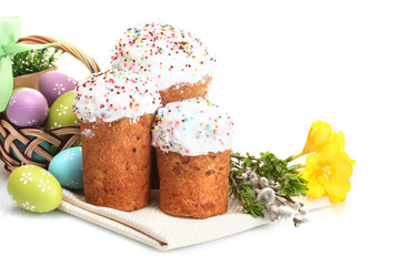 Beautiful Easter cakes, colorful eggs in basket and