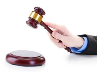 wooden gavel in hand isolated on white