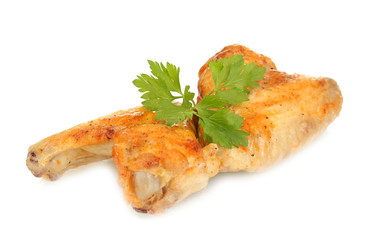 roasted chicken wings with parsley isolated on white