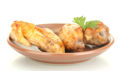 roasted chicken wings with parsley in the plate isolated