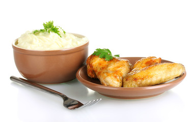 Mashed potato with parsley in the bowl and roasted chicken