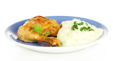 roasted chicken leg with mashed potato in the plate isolated