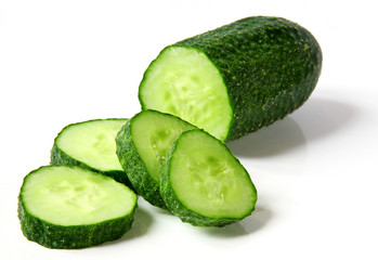 Fresh cucumber and slices on white background