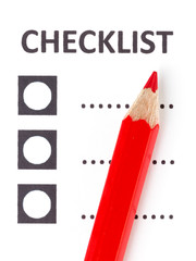 Red pencil on a checklist