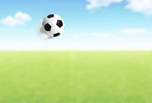 Football ball flying over field