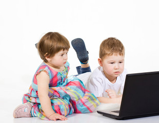 Children look cartoon films on the laptop