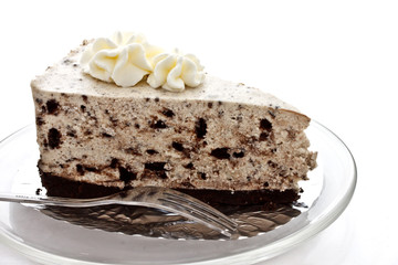 piece of cookie and cream cheese cake on white background