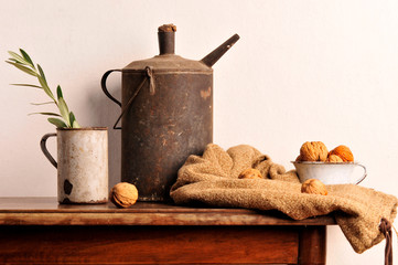 still life with old cans and walnuts