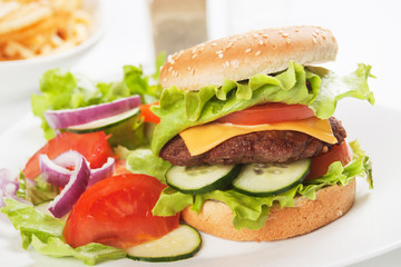 Classic hamburger with vegetable salad