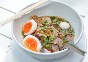 closeup Thai pork Noodles with Boiled egg