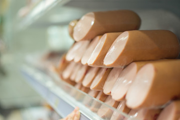 Bunch of sausages delicatessen on sheves in supermarket
