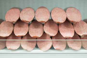 Bunch of sausages delicatessen on sheves in supermarket