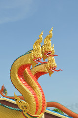 Fototapeta na wymiar Thai dragon, King of Naga statue with three heads in Thailand