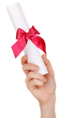 Graduation diploma in hand isolated on white