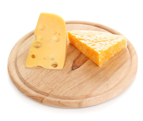 Cheese on cutting board isolated on white