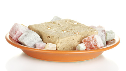 tasty halva and turkish delight in the plate isolated