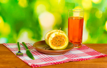 Green passion fruit in the plate on bright green background