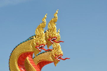 Fototapeta na wymiar Thai dragon, King of Naga statue with three heads in Thailand