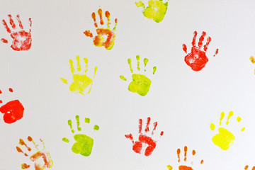 Kids hands prints on the wall background