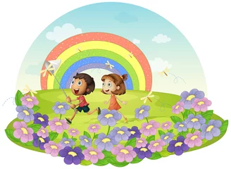 Fotobehang Regenboog Kinderen in een veld jagen op insecten