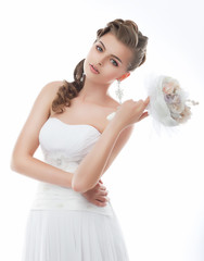 Beautiful girl in wedding dress isolated on white