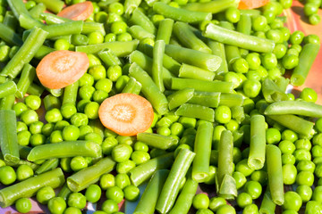 fresh vegetables peas and carrots
