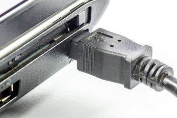 A firewire plug over a white background
