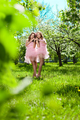 Twins in pink doll style